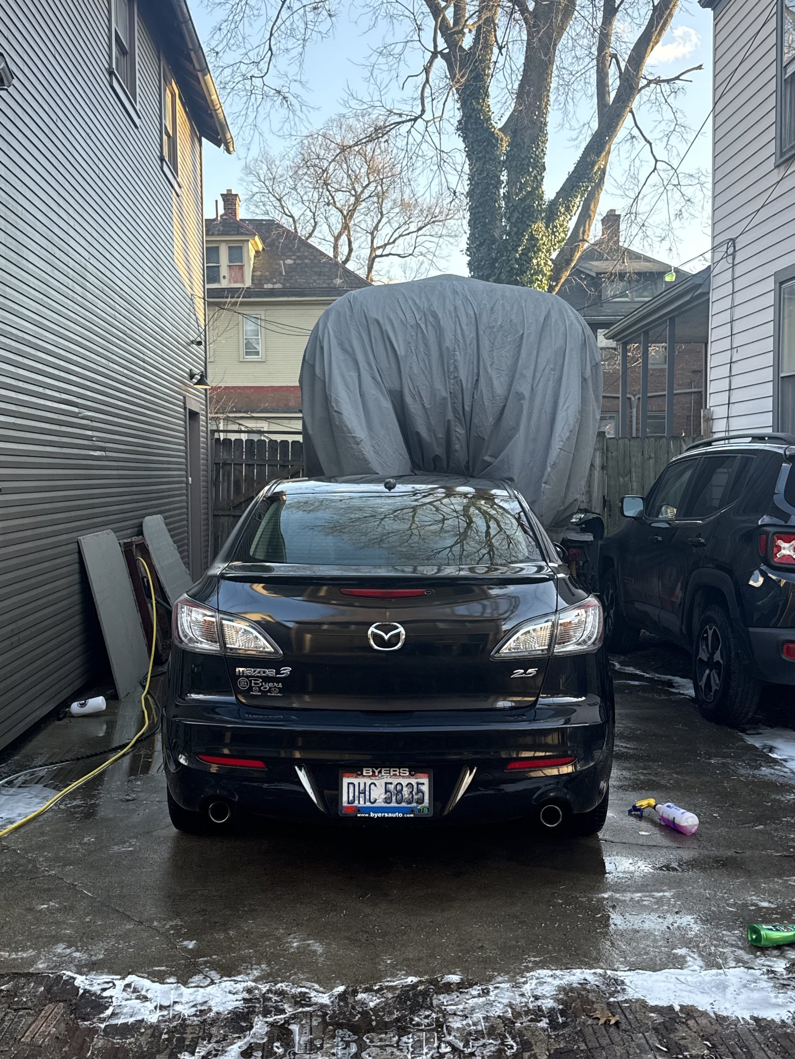 Black Mazda 3 rear view after detailing