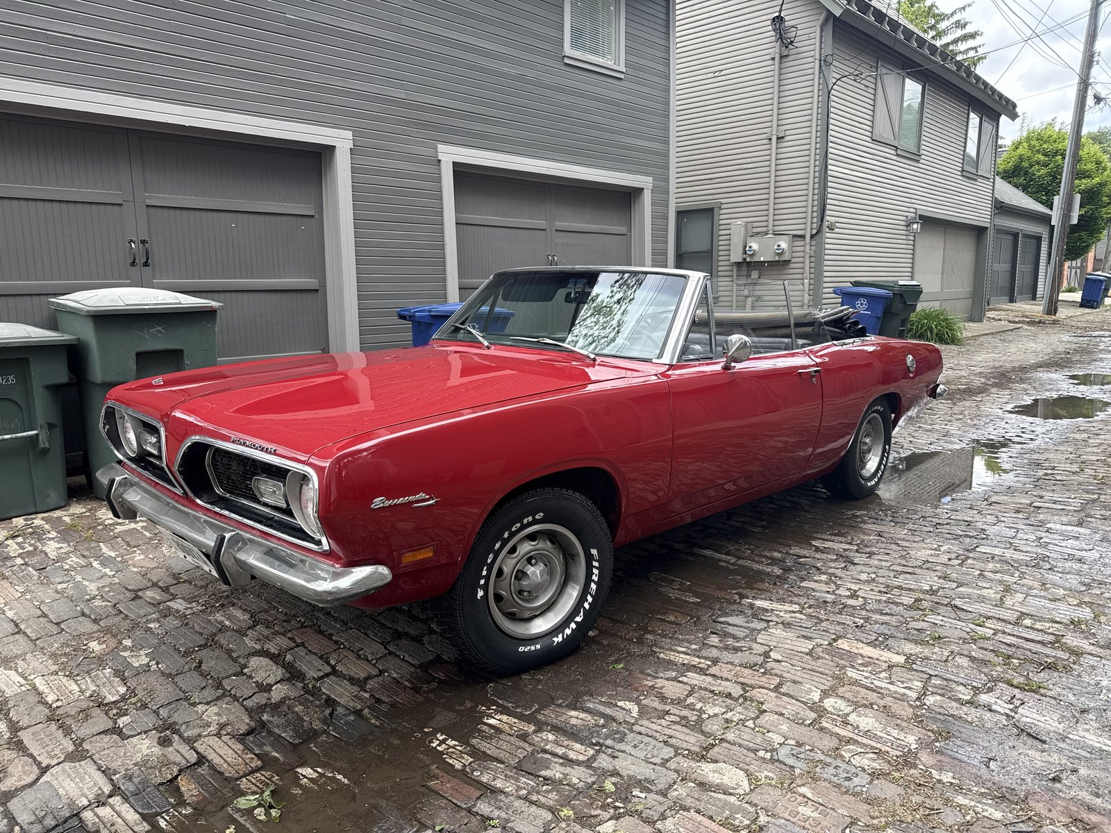 Classic red Plymouth Barracuda convertible after a full detail