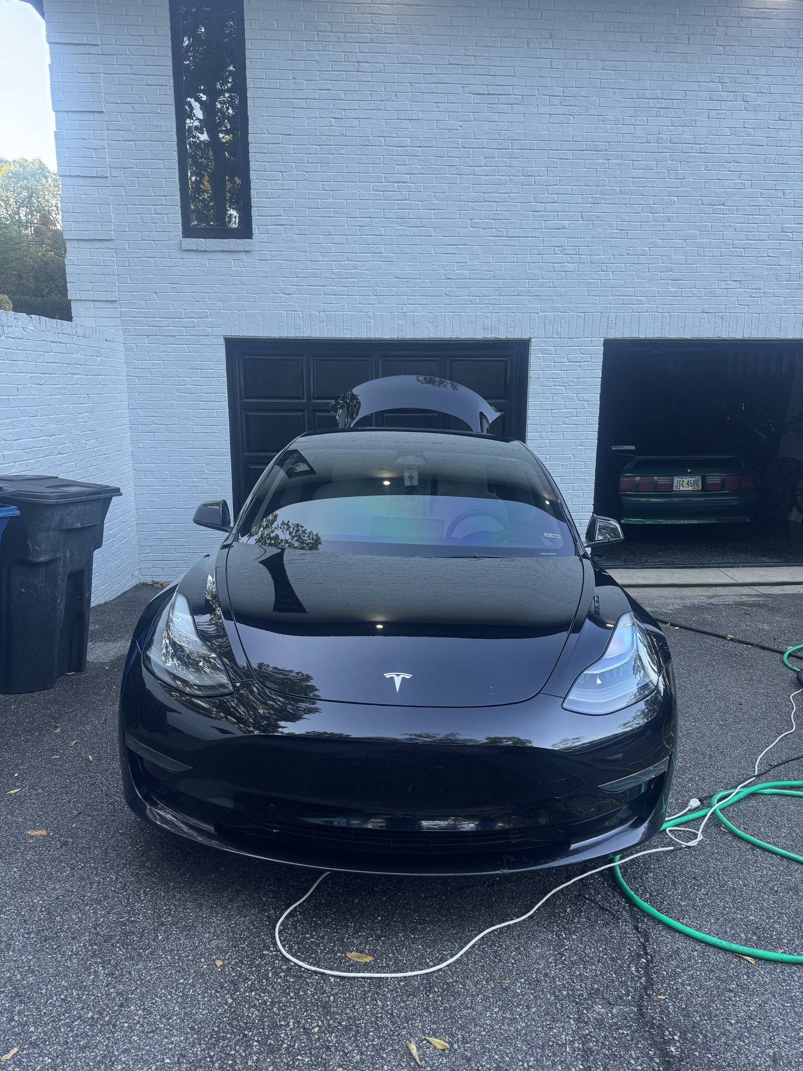 Black Tesla Model 3 after a full detail